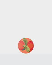 Round Summer paper coasters with a colourful fruit and green leaf print.
