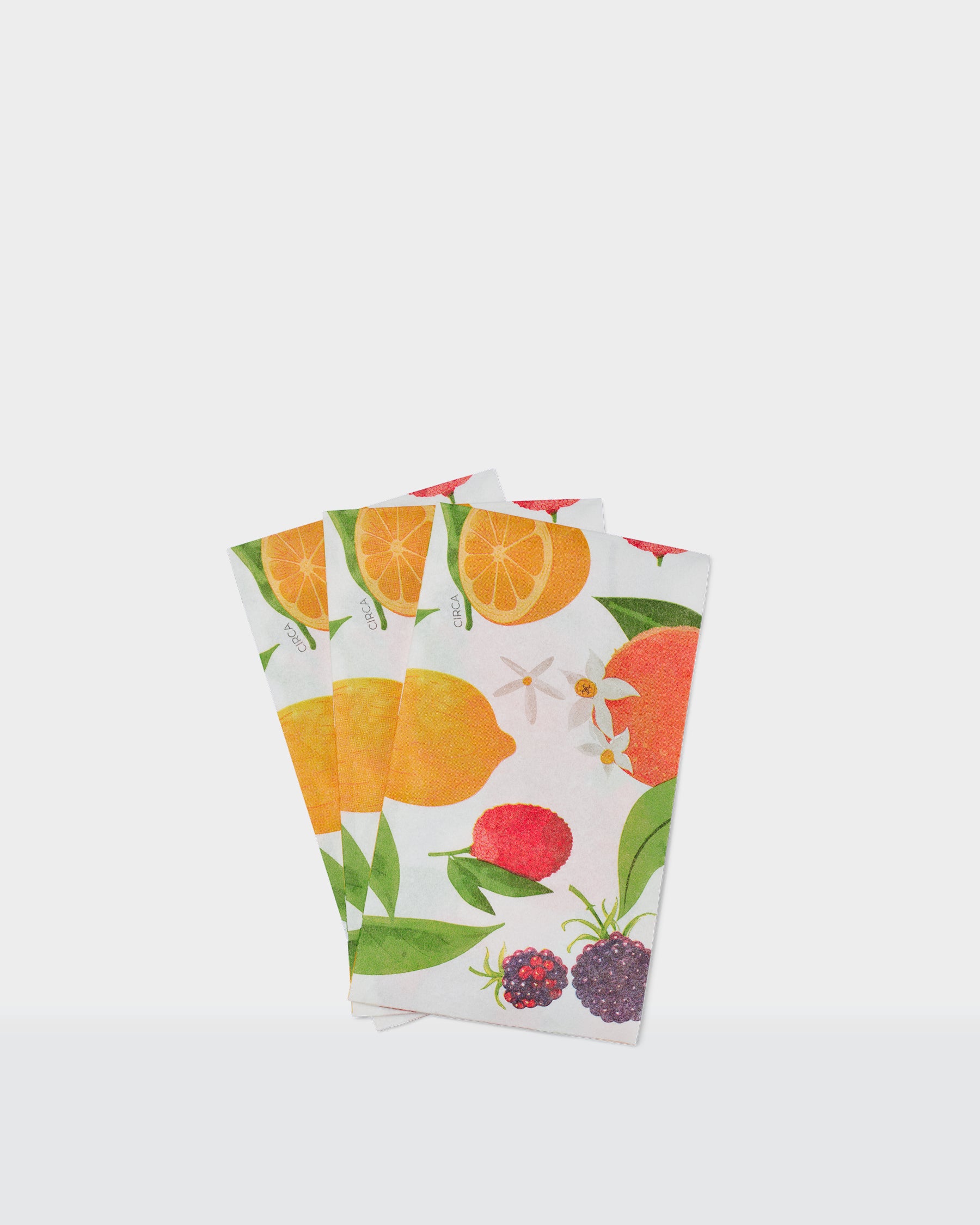 Summer paper dinner napkins with a colourful citrus, green leaf and floral print.