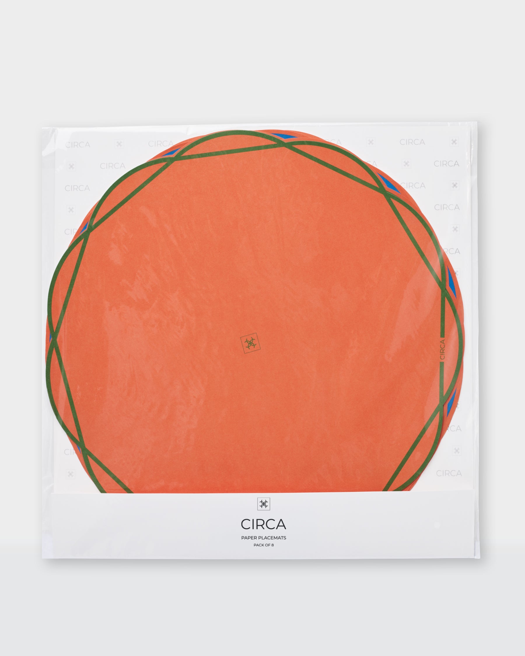 Scalloped Summer paper placemats in blue, green, yellow and coral with contrasting outlines.