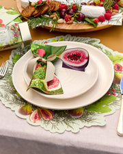 Festive Tableware Pack with green botanical paper tableware and cream bow napkin rings.