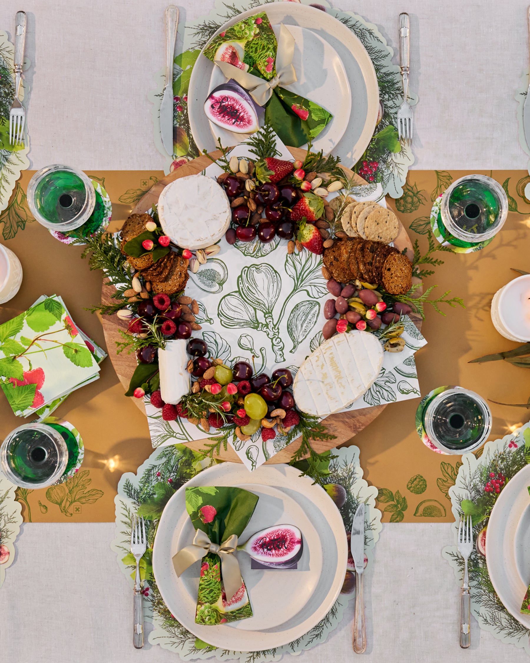 Festive paper table runner in warm brown with green botanical borders.