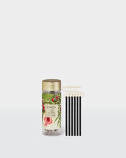 White Fig & Cedar Christmas Tree Scent Stems with hooks beside their botanical storage tube.