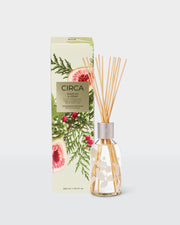 White Fig & Cedar 250ml Fragrance Diffuser with natural fibre reeds beside its front-facing botanical gift box.